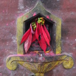 2014.12.15 Bhaktapur 21 Mahakali Temple poinsetta idol ResizeBy Donna Yates CC BY-NC-SA